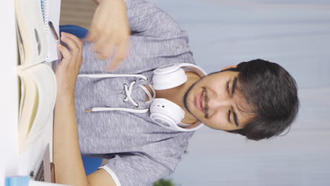Vertical-video-of-Male-student-with-sore-wrists.
